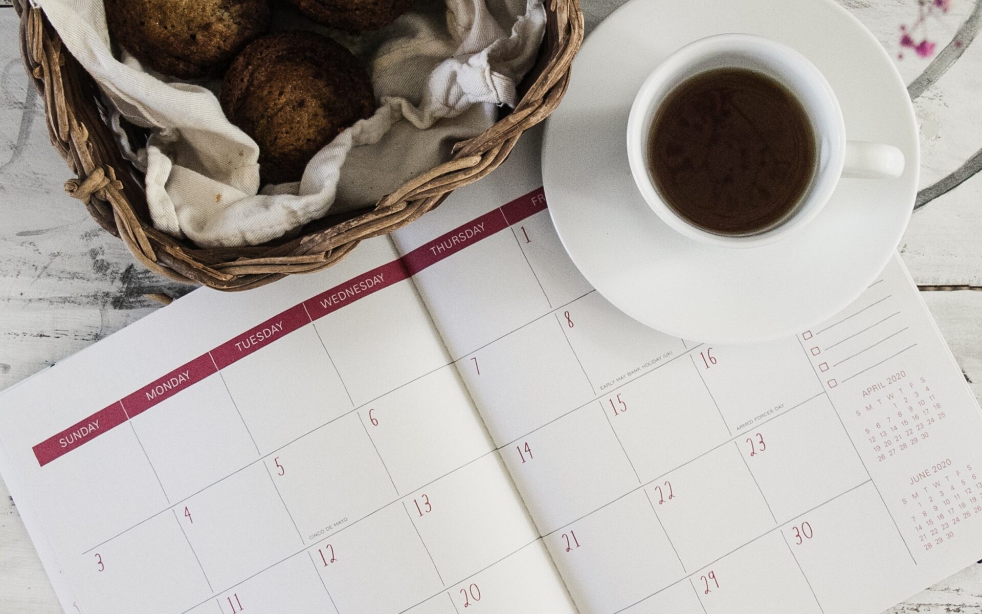 Calendar and cup of coffee